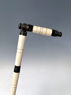 Lot 1022 - An Anglo Indian ivory and horn walking stick,...