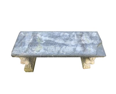 Lot 627 - A Garden bench, the associated stone top...