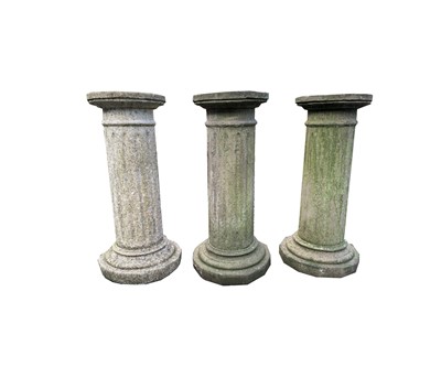 Lot 606 - Three reconstituted stone fluted columns....