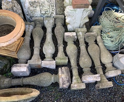 Lot 607 - Eight composition stone balustrades. Height 74cm.