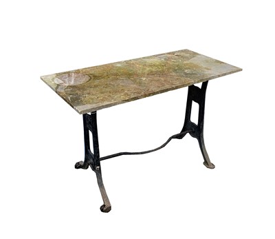 Lot 611 - A marble topped garden table on associated...