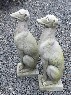 Lot 603 - A pair of reconstituted stone sculptures of...