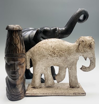 Lot 586 - A large carved ebony elephant, overall height...