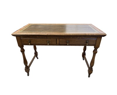 Lot 3051 - An oak writing table, early 20th century, tne...