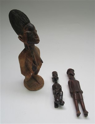 Lot 84 - Three African carved wood figures comprising;...