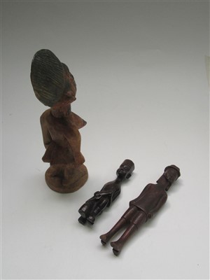 Lot 84 - Three African carved wood figures comprising;...