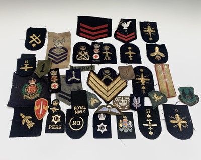 Lot 521 - A collection of sixty assorted military and...