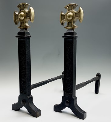 Lot 525 - A pair of wrought iron and brass fire dogs,...