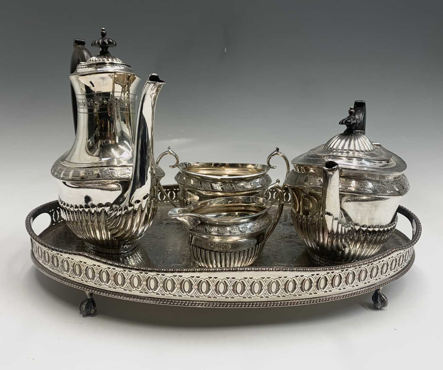 Lot 567 - A Walker and Hall silver plated four piece tea...