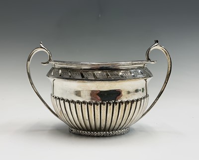 Lot 567 - A Walker and Hall silver plated four piece tea...