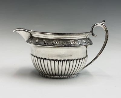 Lot 567 - A Walker and Hall silver plated four piece tea...