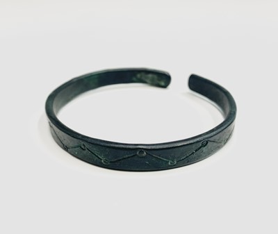 Lot 593 - A Nordic bronze bangle, reputedly Viking era,...