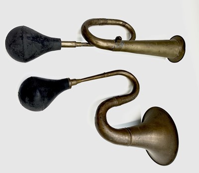 Lot 534 - Two early 20th century brass car horns with...