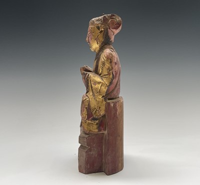 Lot 393 - A Chinese gilt carved wood and painted figure...