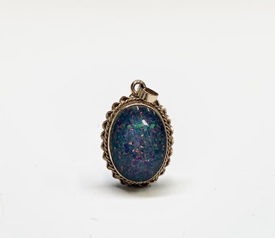 Lot 391 - An opal pendant set in gold and a pair of...