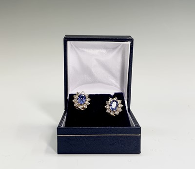 Lot 211 - A pair of good oval pale sapphire and diamond...