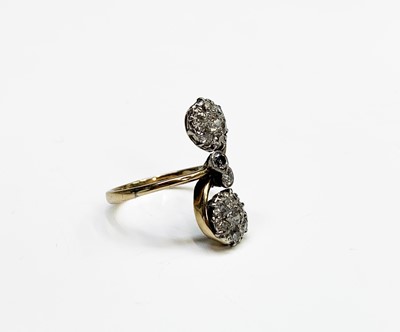 Lot 161 - An unusual Edwardian gold ring with scrolling...