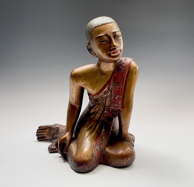 Lot 1059 - A Burmese giltwood figure of a monk, early...