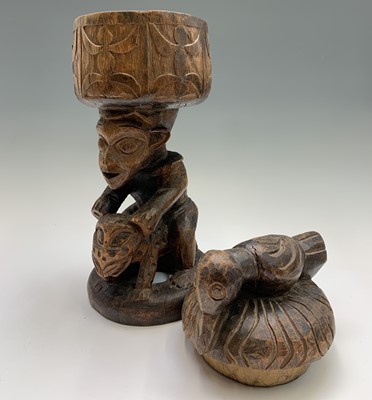 Lot 576 - A West African carved wood figure, modelled...