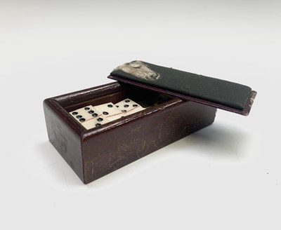 Lot 384 - A set of bone miniature dominoes (two are card...