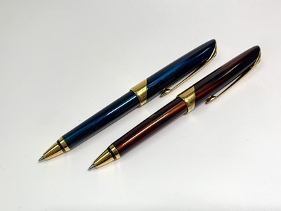 Lot 1091 - Two Parker Ellipse ballpoint pens, one red and...