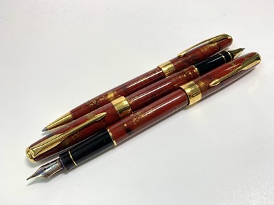 Lot 1104 - A Parker Sonnet Chinese three pen red set with...