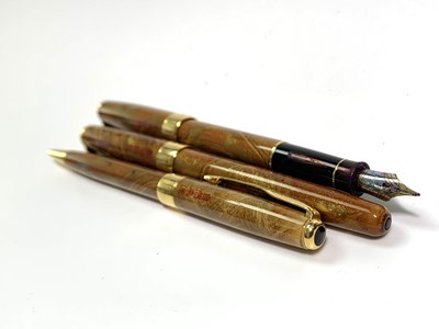 Lot 1105 - A Parker Sonnet Chinese three pen Premier Gold...