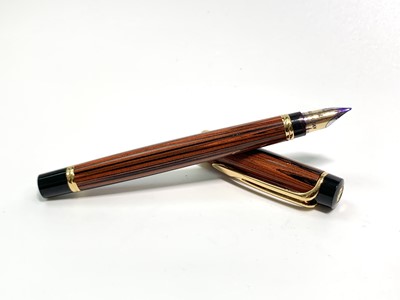 Lot 1113 - A Waterman Liason orange Ebonite fountain pen...