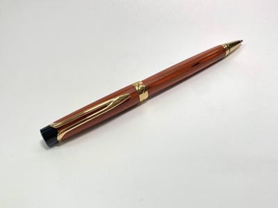 Lot 1114 - A Waterman Liason orange Ebonite ball pen