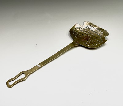 Lot 262 - A Victorian brass cream scoop, 46 x 18cm.