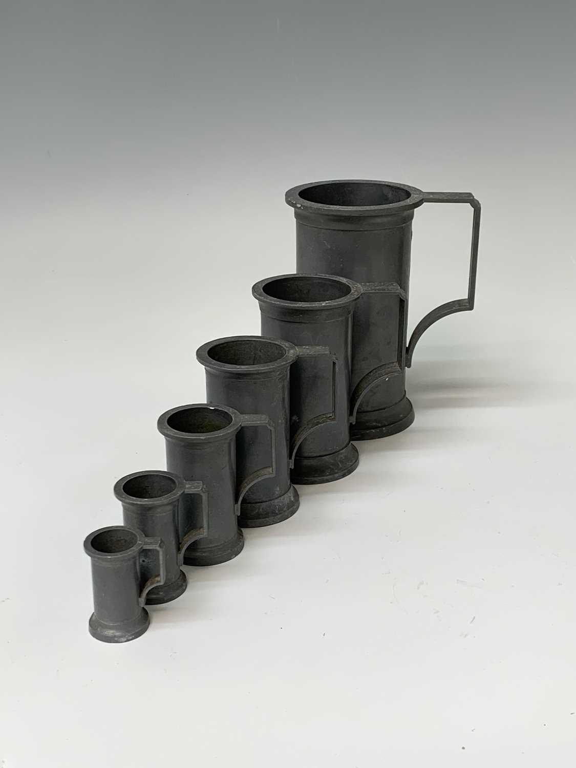 Lot 192 - A set of six pewter measures, 20th century,...