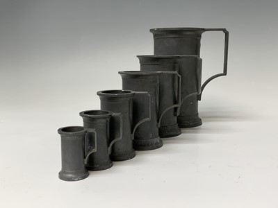 Lot 192 - A set of six pewter measures, 20th century,...