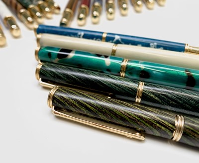 Lot 1119 - Twenty fountain pens, each has a German...