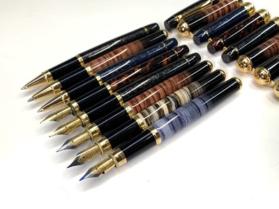 Lot 1124 - Five fountain pens with gold plated mounts and...