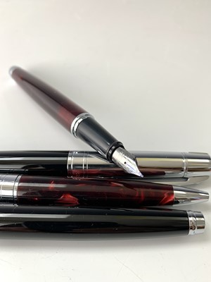 Lot 1160 - A Sheaffer 300 red fountain pen and matching...