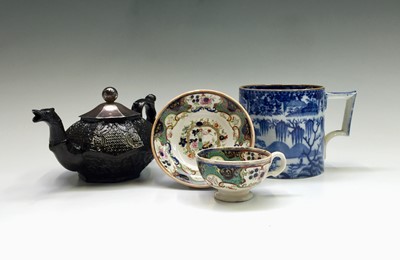 Lot 1140 - A black glazed South Wales Pottery teapot,...