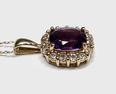 Lot 303 - A 9ct gold mounted amethyst and white stone...