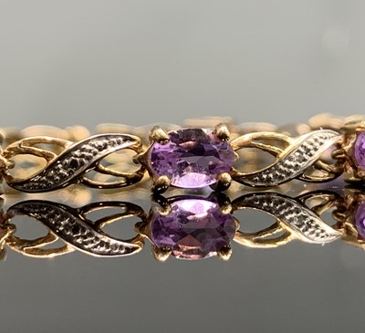 Lot 397 - A gold bracelet set tiny diamonds and amethyst,...