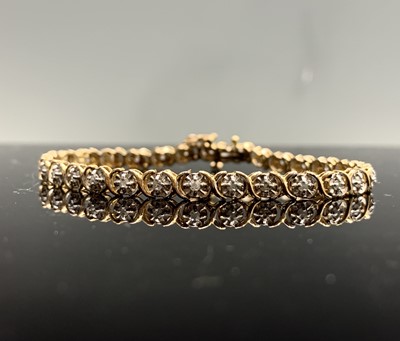 Lot 397 - A gold bracelet set tiny diamonds and amethyst,...