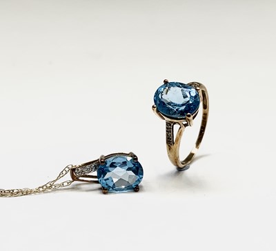 Lot 205 - A 9ct gold blue topaz and diamond ring...