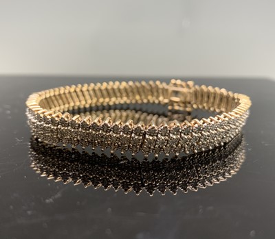 Lot 119 - A 9ct gold bracelet set with over 200 small...
