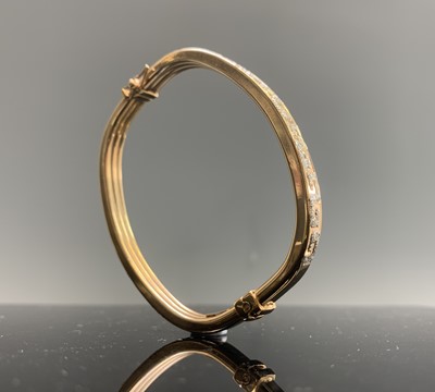 Lot 362 - A 9ct gold Greek key pierced hinged bangle 9.2gm