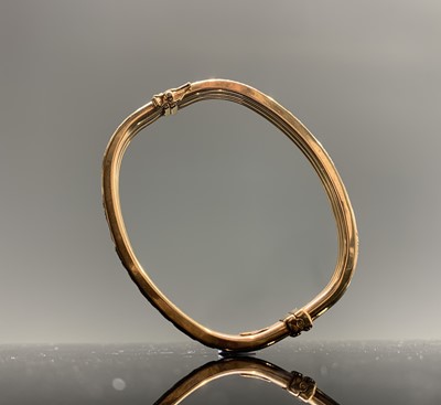 Lot 362 - A 9ct gold Greek key pierced hinged bangle 9.2gm