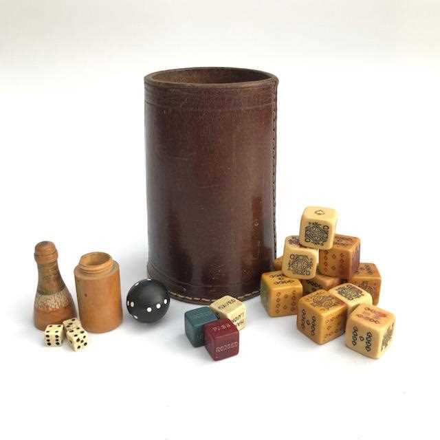 Lot 2701 A leather dice cup and a collection of dice