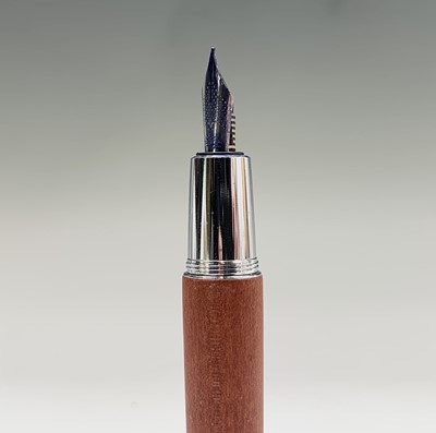 Lot 1196 - A Fabre Castell fountain pen with wood barrel...