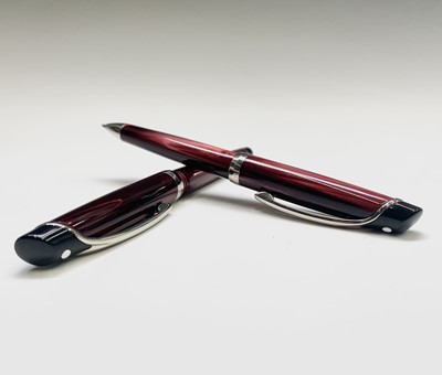 Lot 1227 - A Sheaffer Valor burgundy fountain pen with...