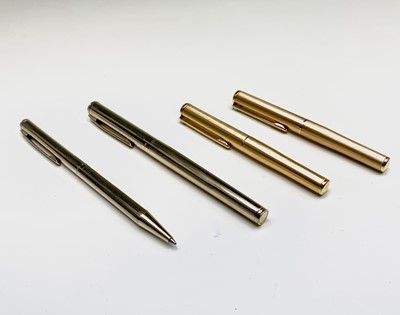 Lot 1230 - A Sheaffer Agio compact gold fountain pen and...