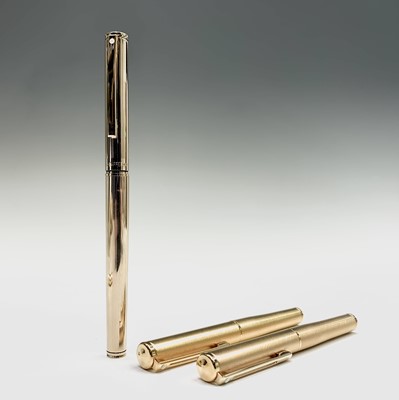 Lot 1230 - A Sheaffer Agio compact gold fountain pen and...