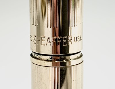 Lot 1230 - A Sheaffer Agio compact gold fountain pen and...