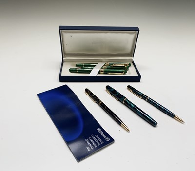 Lot 1242 - A Pelikan three pen set and three Parker pens